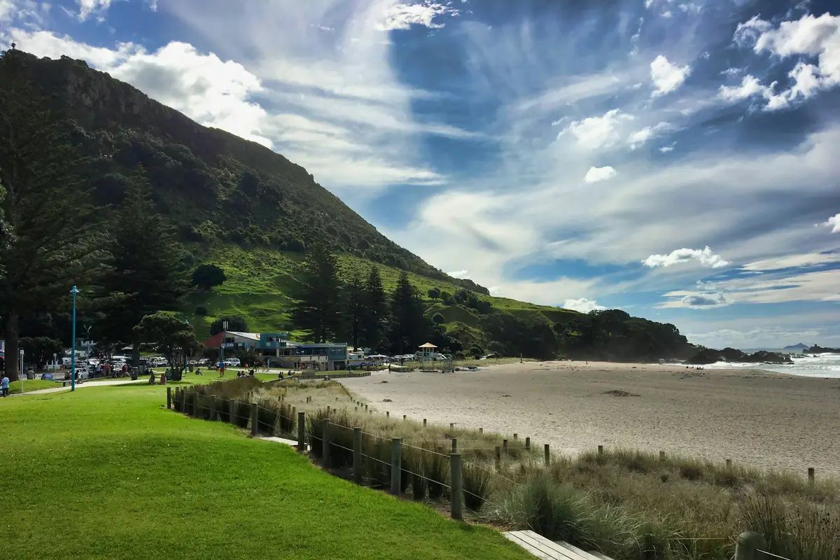 Green grass and Mauao at Mount Maunganui