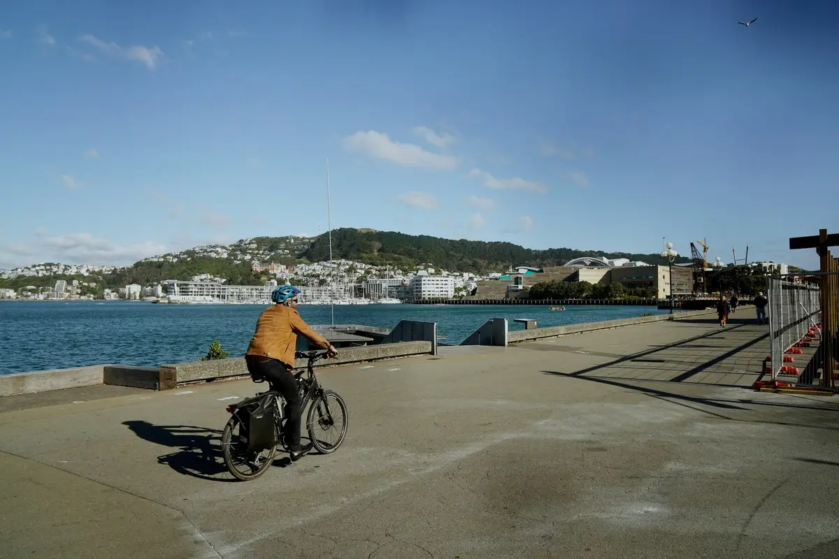Commuter riding an e-bike along the Wellington waterfront