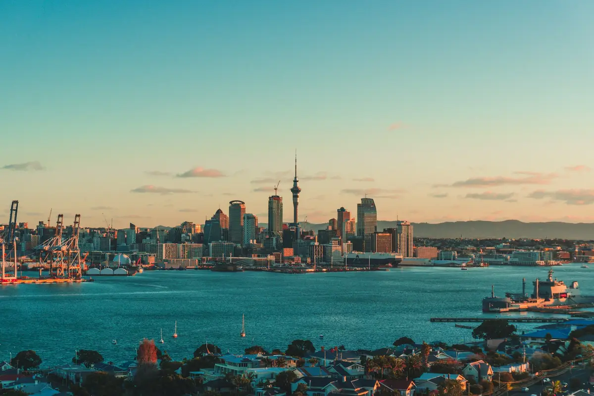 Auckland skyline and harbour in warm late-afternoon light