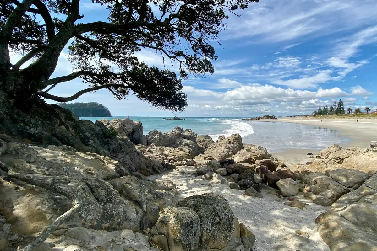 Rocks and blue water at Mount Maunganui beach